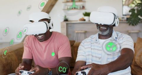 Multigenerational Men Playing VR Games at Home Wearing White Headsets and Controllers