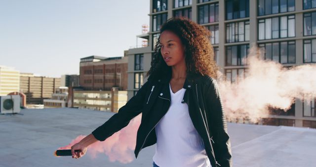 Young Woman Holding Smoke Bomb on Rooftop - Download Free Stock Images Pikwizard.com