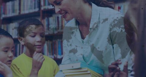 Educator Sharing Books in Library with Children Engaged in Learning