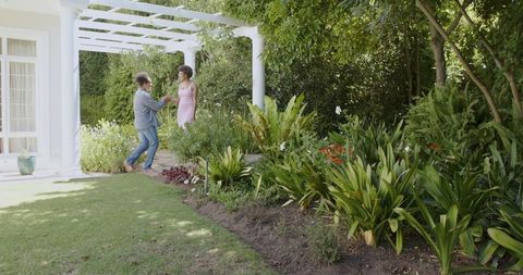 Joyful Dancing Couple Enjoying Garden Wedding Celebration