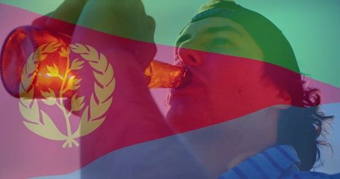Man enjoying beverage with eritrean flag overlay