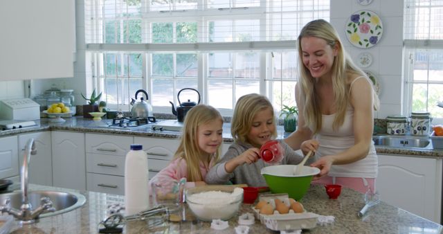 Happy Mother and Children Baking in Bright Kitchen - Download Free Stock Images Pikwizard.com