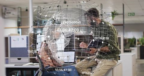 Digital Collaboration in Modern Office with Futuristic Data Globe Overlay