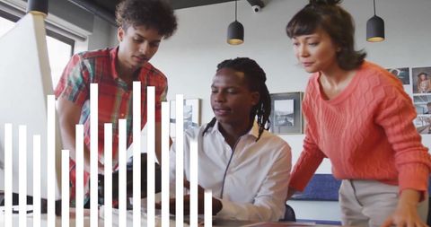 Diverse Colleagues Collaborating Over Data Insights in Office