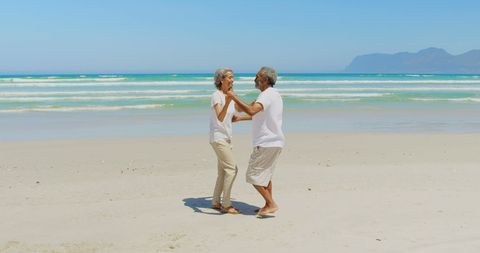 Happy Senior African American Couple Dancing Joyfully on Beach - Download Free Stock Images Pikwizard.com