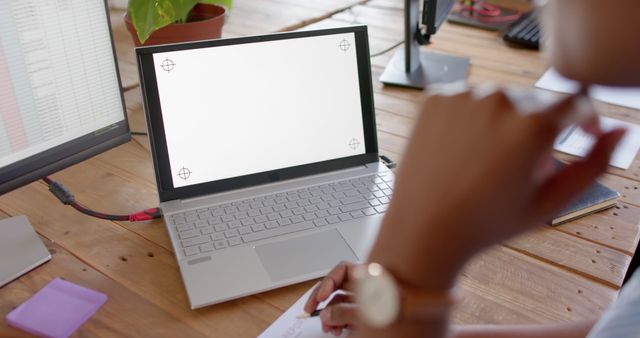 Professional Woman Working on Laptop in Modern Office Environment - Download Free Stock Images Pikwizard.com