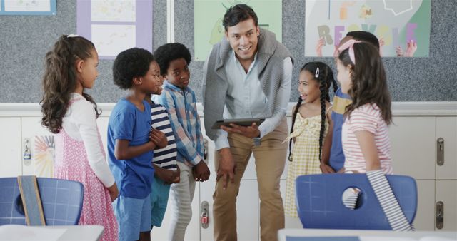 Teacher Engaging With Diverse Group of Young Students in Classroom - Download Free Stock Images Pikwizard.com