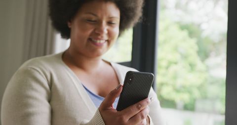 Happy Woman Enjoying Smartphone at Home - Download Free Stock Images Pikwizard.com