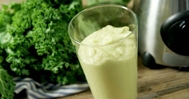 A green smoothie and kale signify a commitment to wellness and clean eating. - Download Free Stock Photos Pikwizard.com