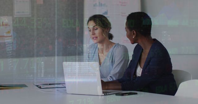 Two Businesswomen Analyzing Financial Data on Laptop - Download Free Stock Images Pikwizard.com