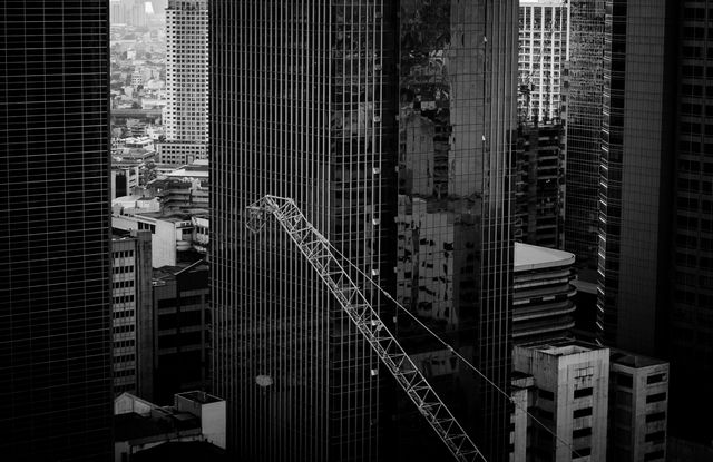 Black and White Cityscape with Skyscrapers and Construction Crane - Download Free Stock Photos Pikwizard.com