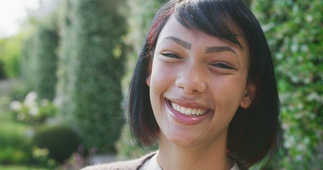 Smiling Young Woman Outdoors on a Sunny Day - Download Free Stock Images Pikwizard.com