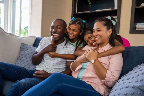 Happy Diverse Family Enjoying Quality Time on Cozy Sofa