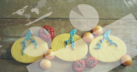 Pumpkin sugar cookies with blue icing stems on rustic wood with infographic overlays