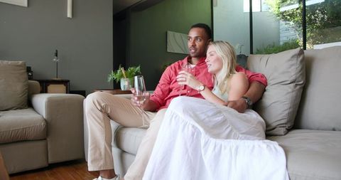 Couple Enjoying Romantic Moment with Champaign at Home