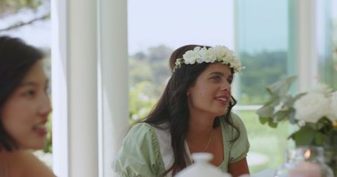 Joyful Gathering at Wedding Reception with Floral Decor