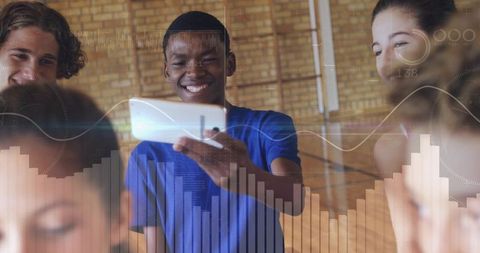 Smiling teen showing smartphone to friends with digital data overlays in school gym