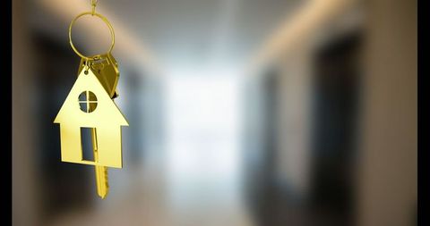 Golden house keychain symbolizing luxury living and modern elegance