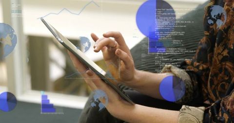 Woman tapping tablet with data overlays and analytics charts in modern office lounge space