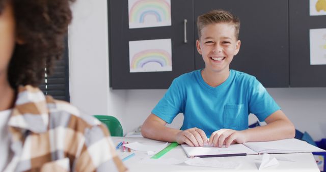 Smiling Boy in Classroom Working on School Project - Download Free Stock Images Pikwizard.com