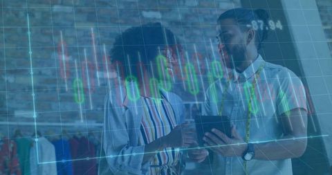 Design team analyzing fashion trends with digital analytics