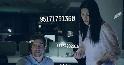 Business Professionals Analyzing Data Streams in Modern Office