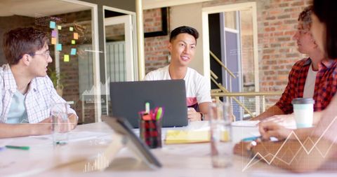 Diverse Professionals Discuss Financial Insights in Meeting Room