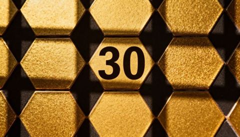Golden honeycomb hexagon panel featuring number 30 metallic tile luxury pattern