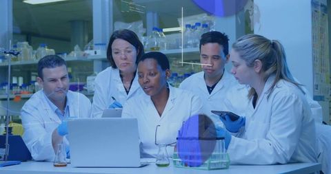 Researchers Collaborating in Laboratory with Modern Technology