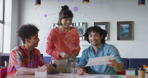 Professionals Collaborating with Technology at Office Table