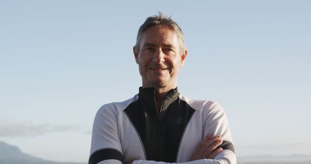 Confident Middle-aged Man Smiling Against Clear Sky Outdoors - Download Free Stock Images Pikwizard.com