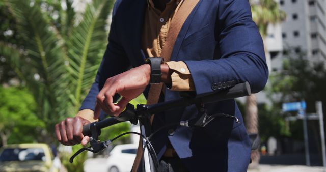 Businessman Biking Outdoors on a Sunny Day in Urban Scenery - Download Free Stock Images Pikwizard.com