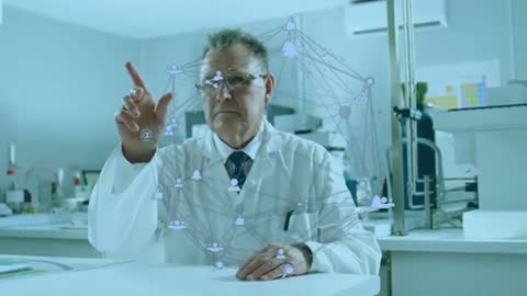 Senior Scientist Exploring Digital Network Interface in Lab