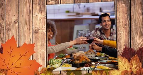 Friends toasting around rustic thanksgiving dinner table with roasted turkey