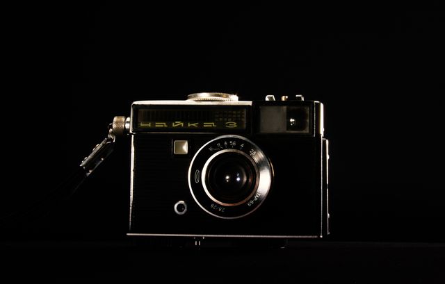 Vintage Film Camera Isolated on Black Background - Download Free Stock Photos Pikwizard.com