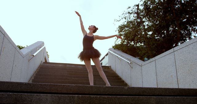 Ballerina in Black Tutu Dancing on Urban Staircase at Sunset - Download Free Stock Images Pikwizard.com