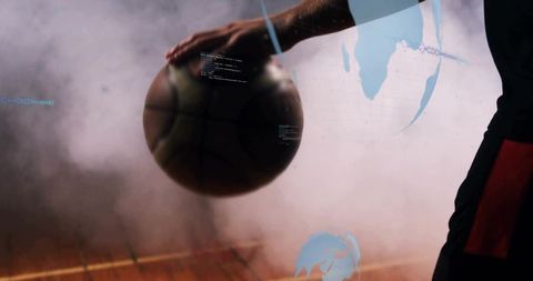 Resting basketball player holding ball on hardwood court with smoke, blue digital overlays