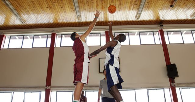 Two Basketball Players Competing on Court for Ball - Download Free Stock Images Pikwizard.com