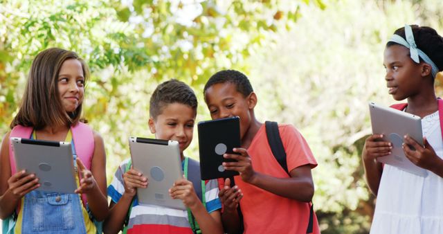 Group of Diverse Children Using Tablets Outdoors - Download Free Stock Images Pikwizard.com