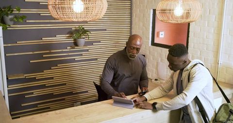 Professional guidance at reception: african american mentor with client