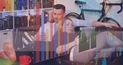 Couple Relaxing on Sofa Using Smartphones with Financial Overlay