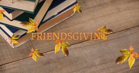 Friendsgiving Celebration Over Autumn Leaves and Books