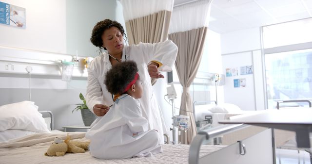 Female Doctor Examining Child Patient in Hospital Room - Download Free Stock Images Pikwizard.com