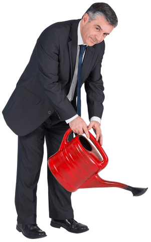 mature businessman holding red watering can isolated on white background - Download Free Stock Videos Pikwizard.com