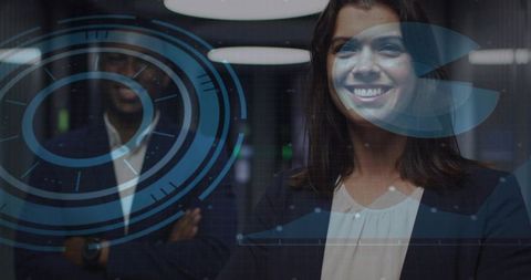 Smiling professional woman viewing futuristic blue ar interface overlay in modern office