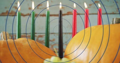 Kinara burning candles and pumpkins for kwanzaa centerpiece rustic autumn decor