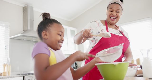 Mother and Daughter Enjoy Baking Together at Home - Download Free Stock Images Pikwizard.com