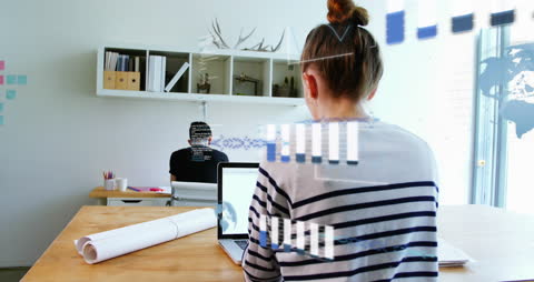 Creative Professionals Analyzing Financial Data with Digital Graphics