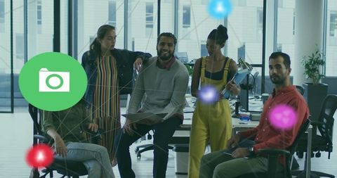 Diverse Team Collaborating in Modern Office with Tech Devices