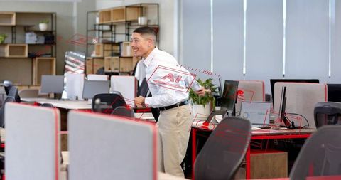 Office employee gesturing at ai holograms over open-plan workspace with laptops, monitors